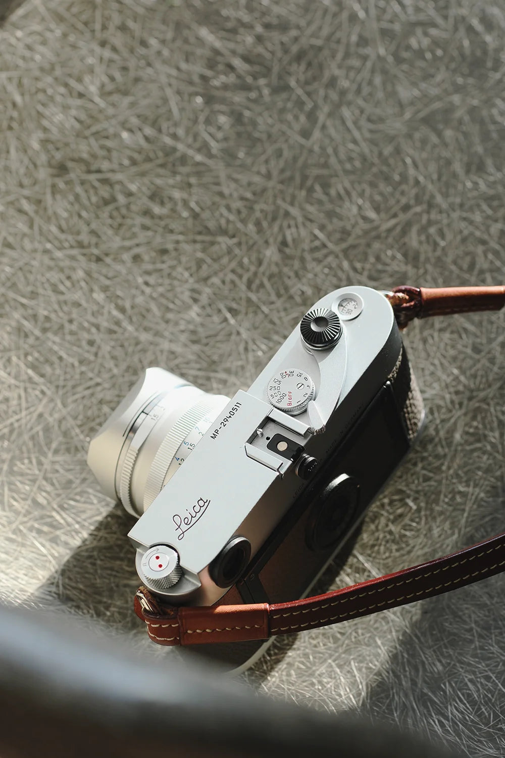 Vintage Leica camera on a textured surface